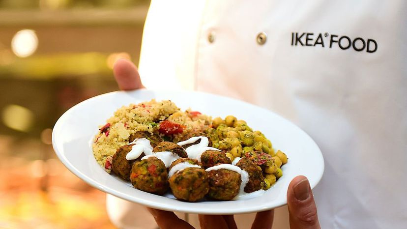 An Ikea employee displays the the company's vegetarian meatballs, during a worldwide launch at Ikea Anderlecht in Belgium, on April 8, 2015. EMMANUEL DUNAND/AFP/Getty Images