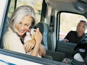 Lots of kisses before the pooch gets dropped off at the kennel. See more pet pictures.