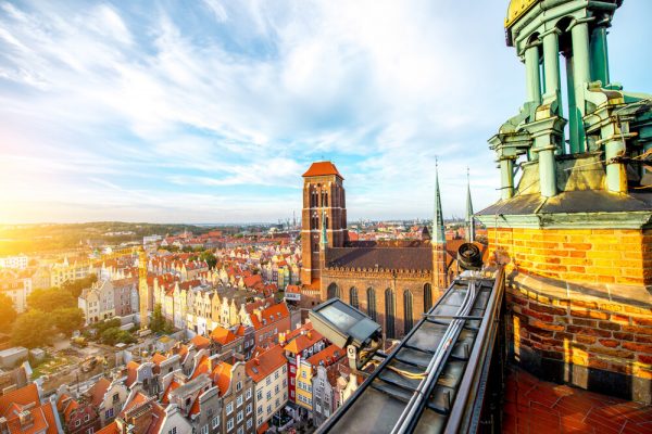 Cityscape aerial view on the old town with saint Marys church on the sunset in Gdansk, Poland